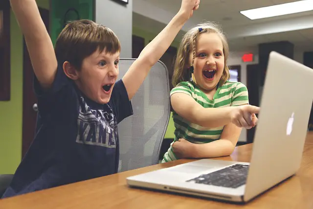 excited children at computer