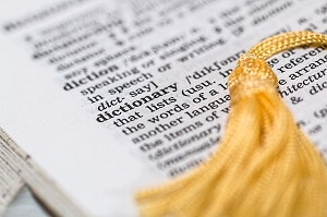 open dictionary with tassel