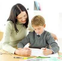 Mom helping son with spelling lesson