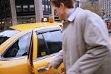 man getting into a taxi