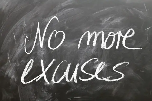 "No More Excuses" written on a chalkboard