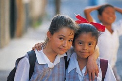 two third grade girls, arm in arm