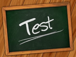 "TEST" written on a small, framed chalkboard